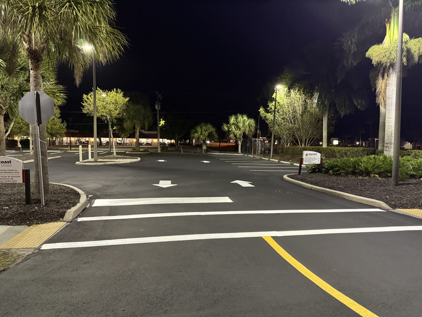 Freshly sealcoated and striped parking lot at dusk in Cape Coral, Florida